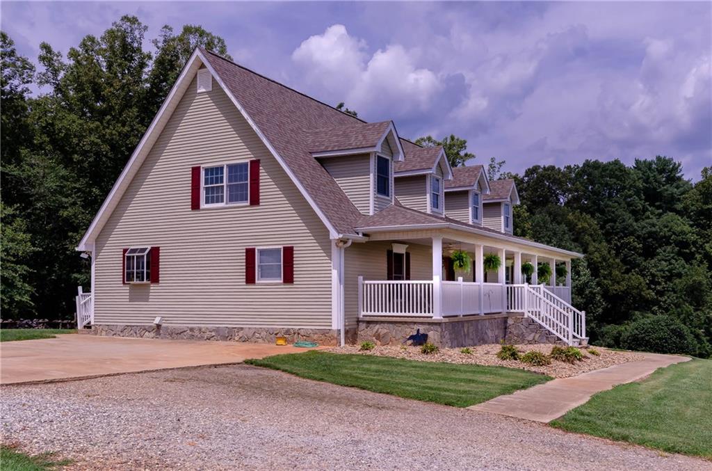 6673 Jenkins Road Morganton, NC 28655 - Photo 2 of 32 a front view of a house with garden