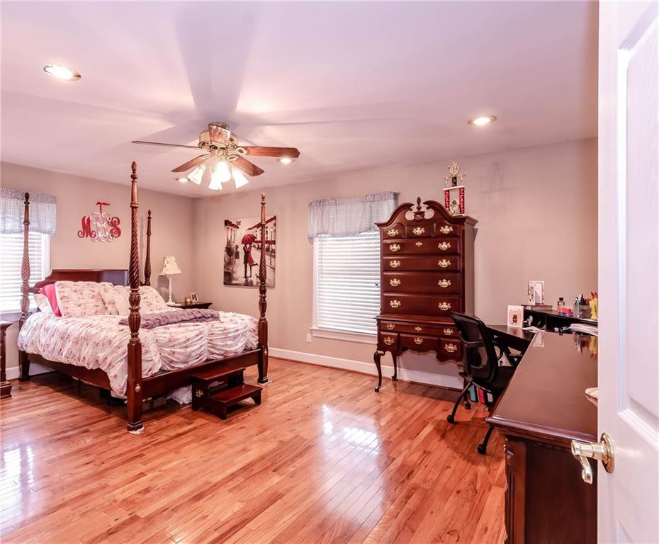 6673 Jenkins Road Morganton, NC 28655 - Photo 14 of 32 a bedroom with furniture and wooden floor