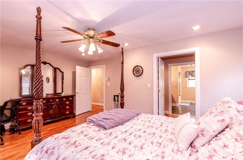 6673 Jenkins Road Morganton, NC 28655 - Photo 15 of 32 a bedroom with a bed and a chandelier