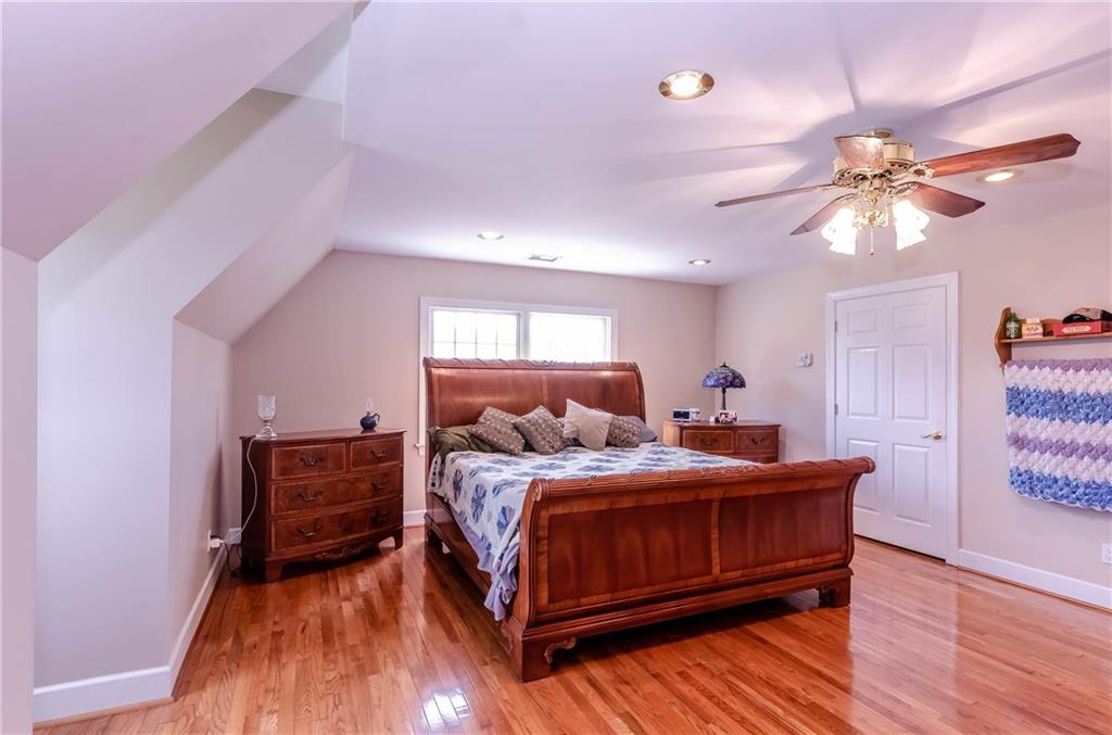 6673 Jenkins Road Morganton, NC 28655 - Photo 18 of 32 a bedroom with a bed and dresser