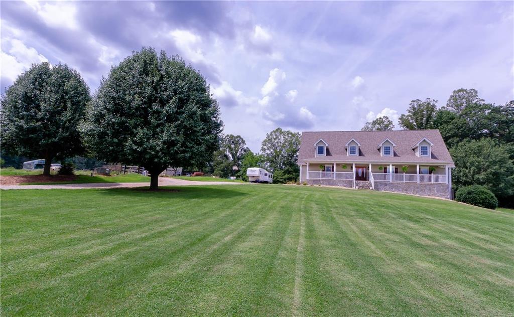 6673 Jenkins Road Morganton, NC 28655 - Photo 3 of 32 a view of a big yard with a house in the background