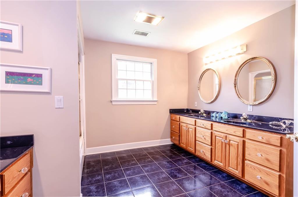 6673 Jenkins Road Morganton, NC 28655 - Photo 21 of 32 a room with mirror furniture and a window