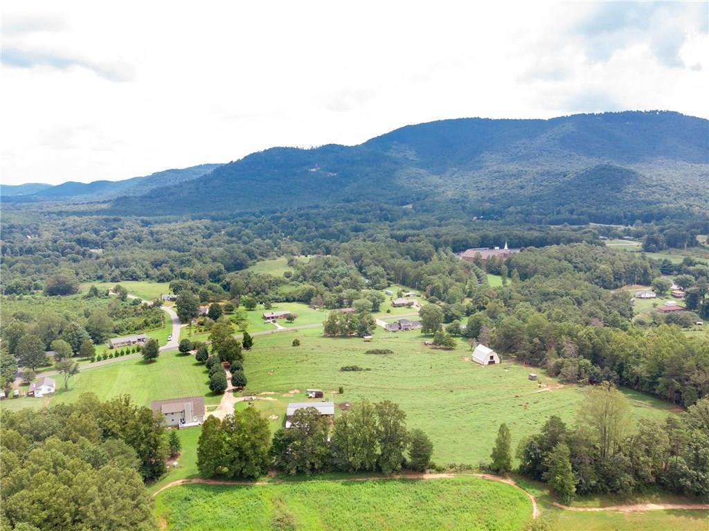6673 Jenkins Road Morganton, NC 28655 - Photo 32 of 32 a view of a lush green hillside and houses