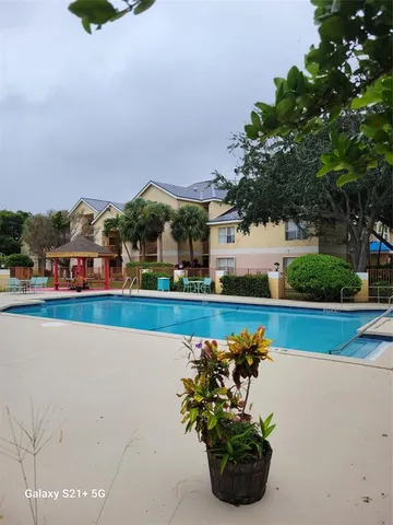 a view of swimming pool is outdoor seating