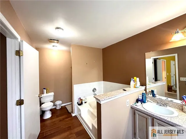 a view of bathroom with dual sinks