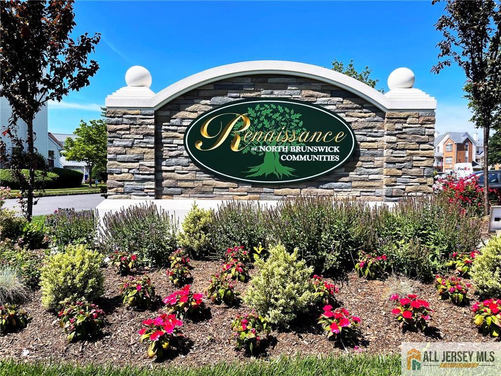 173 Salem Road North Brunswick, NJ 08902 - Photo 2 of 16 a sign that is sitting in front of flowers