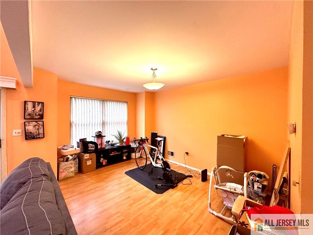 173 Salem Road North Brunswick, NJ 08902 - Photo 7 of 16 a living room with furniture window and flat screen tv