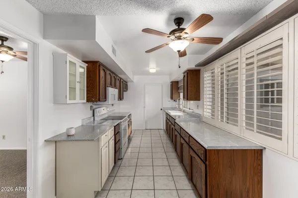 a kitchen with stainless steel appliances a sink and a stove