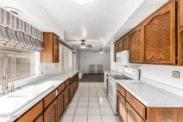 a spacious bathroom with a double vanity sink and a large mirror