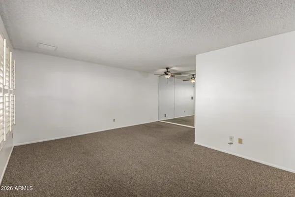 an empty room with a empty space and a window