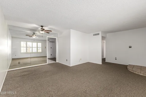 a view of an empty room with a window