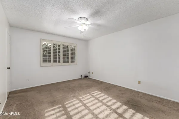a view of an empty room with windows