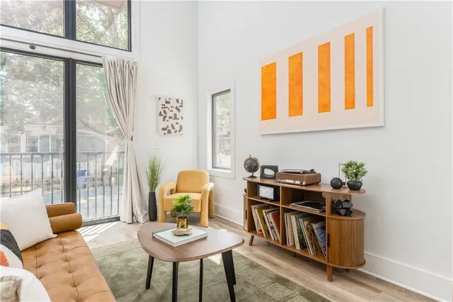 a living room with furniture and a window