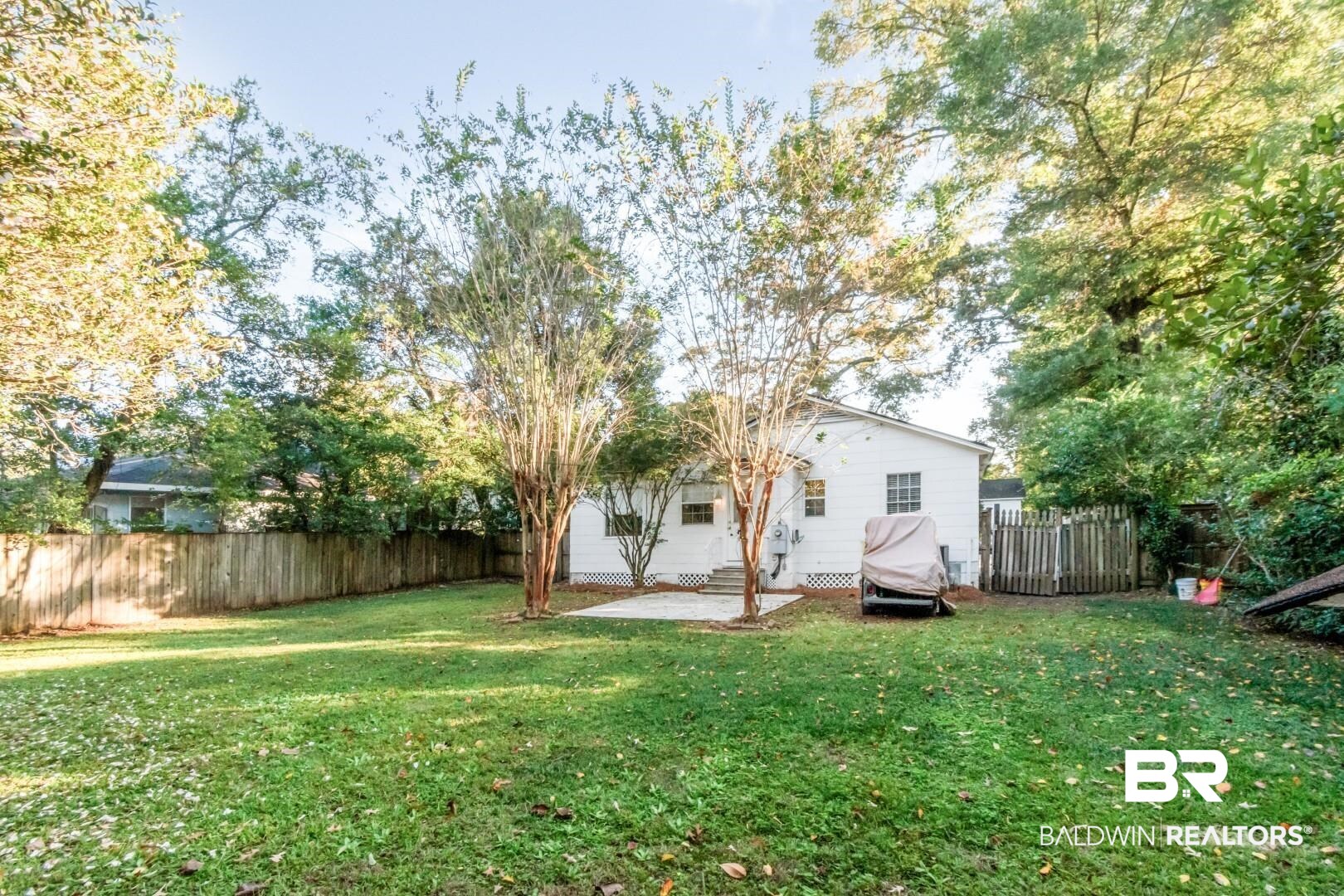 16 Princess Anne Road Mobile, AL 36608 - Photo 32 of 40 Back of property with a patio area and a fenced backyard