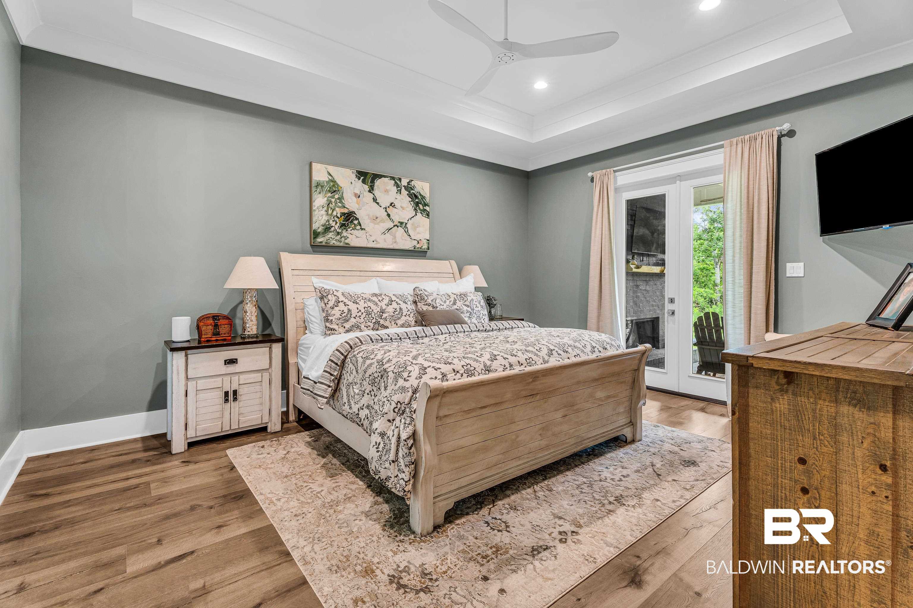 17541 Polo Ridge Boulevard Fairhope, AL 36532 - Photo 9 of 19 Spacious room featuring wood-finish flooring, tray ceiling, recessed lighting, and a contemporary ceiling fan