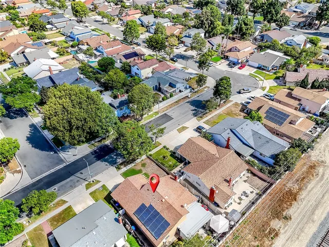 an aerial view of residential houses with outdoor space