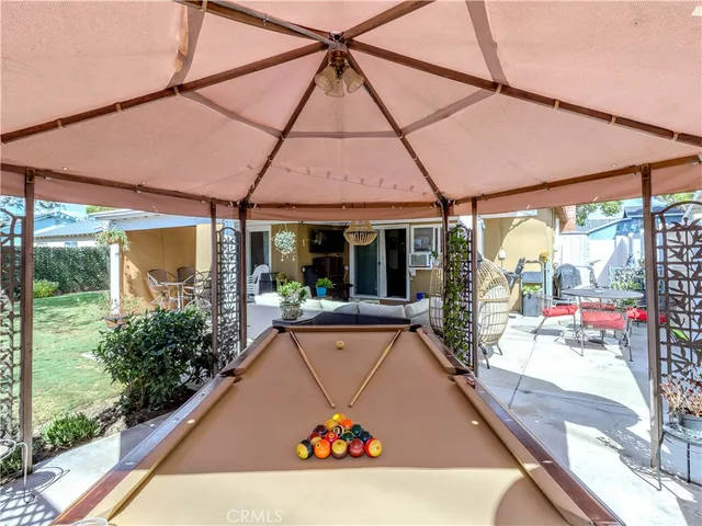 a view of a couches and table in the patio