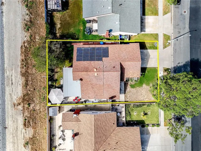 an aerial view of houses with outdoor space