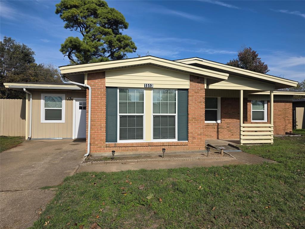 1513 Arcady Lane Irving, TX 75061 - Photo 1 of 20 a front view of a house with a garden