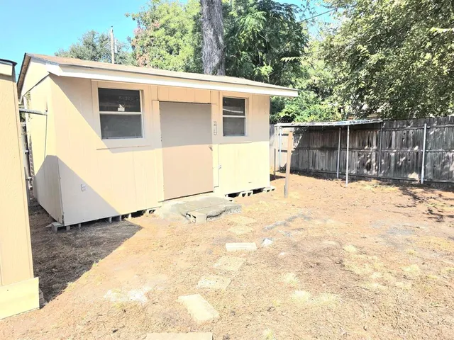 a view of a house with a snow in the yard