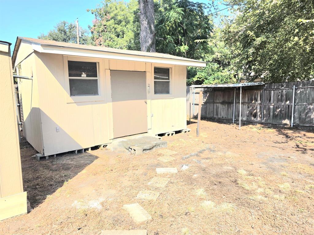 1513 Arcady Lane Irving, TX 75061 - Photo 13 of 20 a view of a house with a snow in the yard