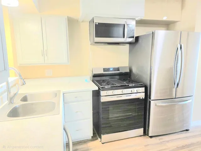 a kitchen with a stove and a refrigerator
