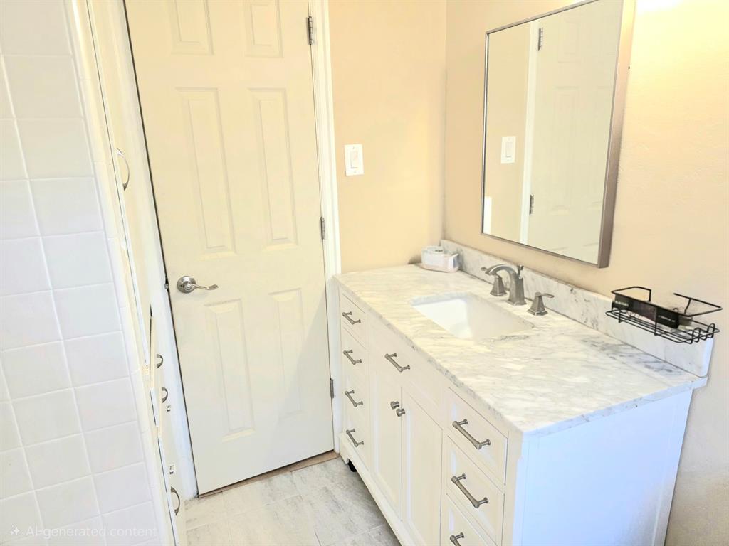 1513 Arcady Lane Irving, TX 75061 - Photo 10 of 20 a bathroom with a sink and a mirror