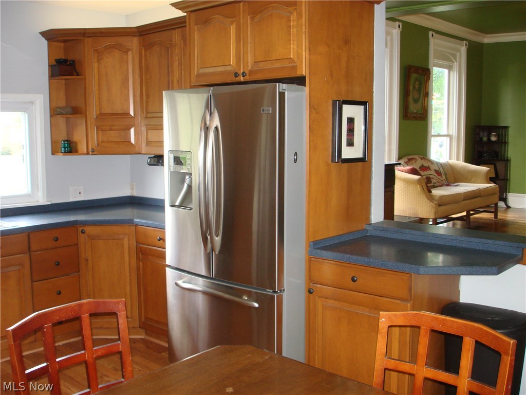 919 Richmond Road Cleveland, OH 44124 - Photo 19 of 35 Kitchen opens up to the family room and has a beautiful stainless steel newer refrigerator, Corian countertops