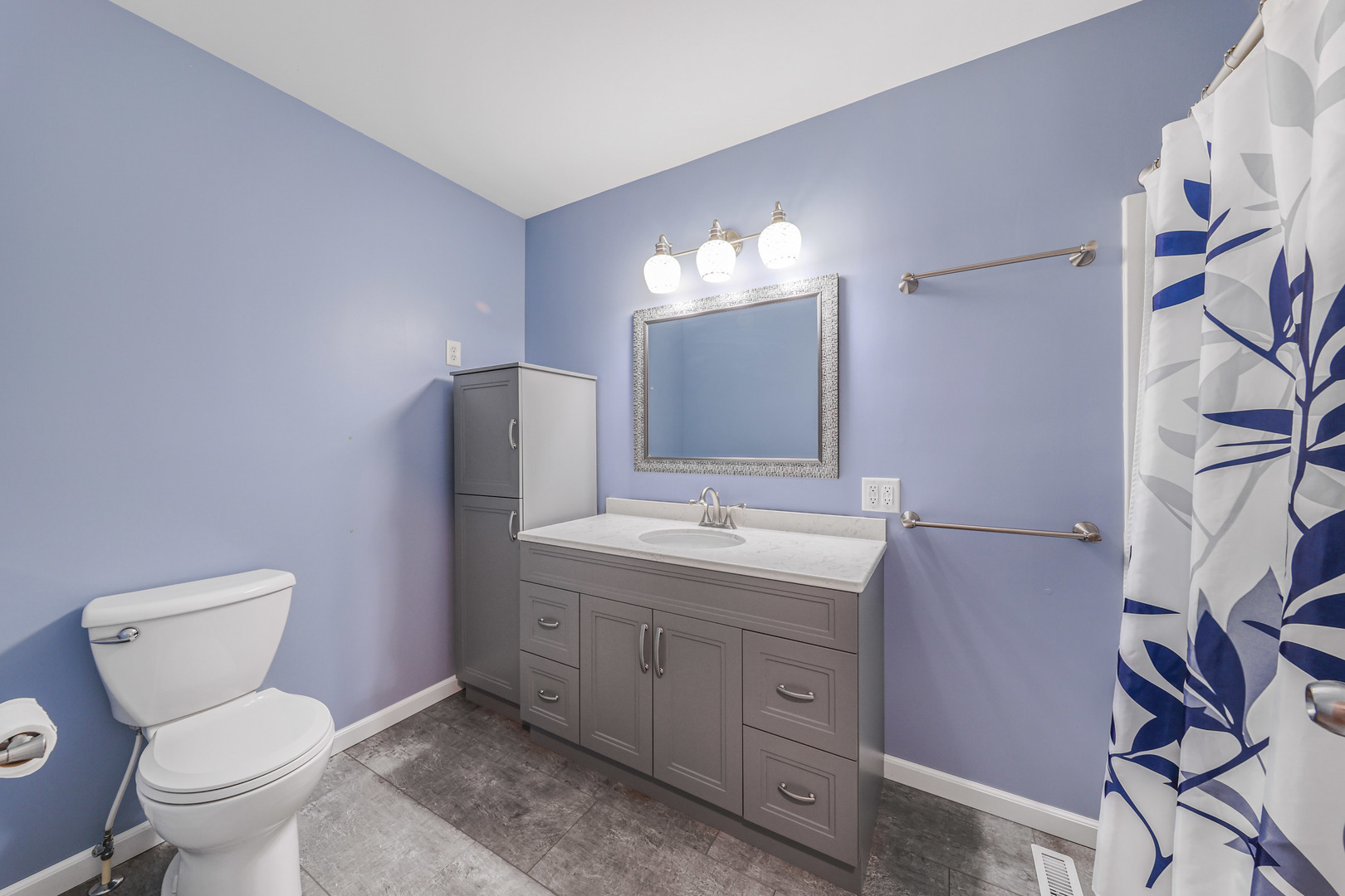 2433 East 2850th Road Marseilles, IL 61341 - Photo 10 of 20 a bathroom with a toilet sink and mirror