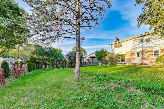 a backyard of a house with lots of green space