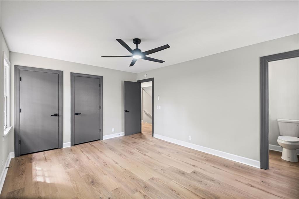7 East Creekview Drive Southwest Rome, GA 30165 - Photo 18 of 43 a view of a room with wooden floor and a ceiling fan