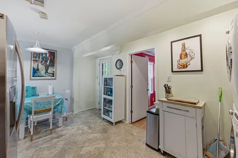 a view of room with window and furniture