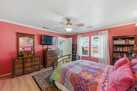 a bed room with a bed and a television