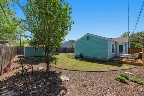 a view of a backyard with sitting area