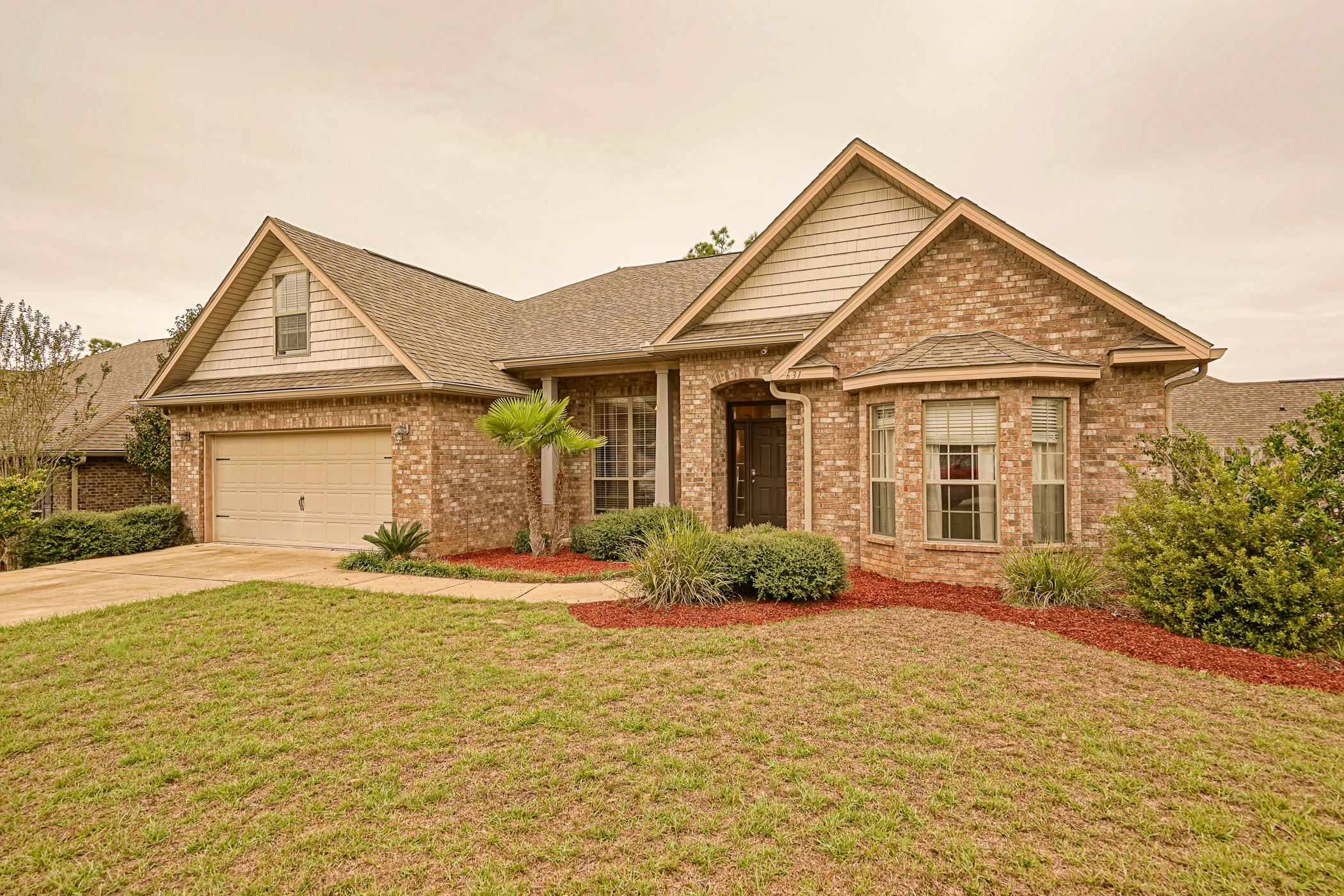 631 Red Fern Road Crestview, FL 32536 - Photo 1 of 23 a front view of a house with a yard