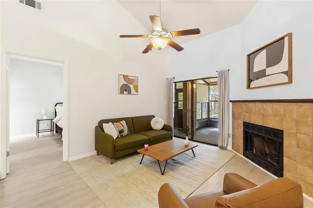 a living room with furniture and a fireplace