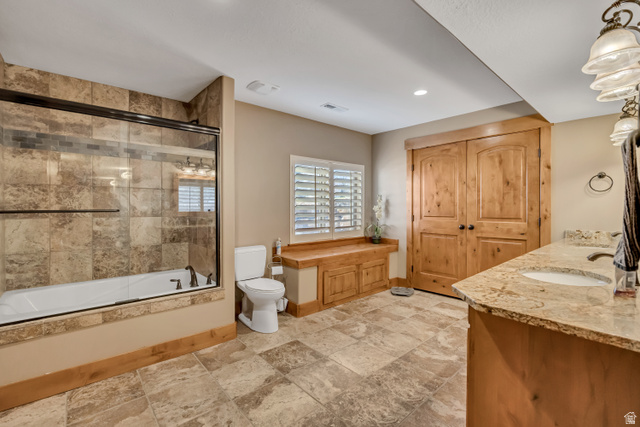 896 West 675 South Mapleton, UT 84664 - Photo 41 of 77 Bathroom with bath / shower combo with glass door, double vanity, stone tile flooring, and recessed lighting