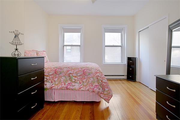 51 Anderson Street, Unit 1 Boston, MA 02114 - Photo 1 of 6 a bedroom with a bed and a window