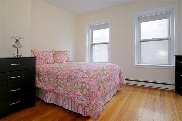 51 Anderson Street, Unit 1 Boston, MA 02114 - Photo 2 of 6 a bedroom with a bed and a window