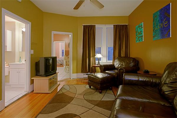 51 Anderson Street, Unit 1 Boston, MA 02114 - Photo 5 of 6 a living room with furniture and a flat screen tv