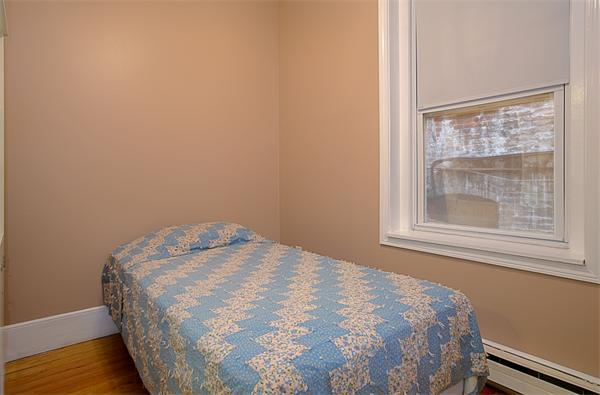 51 Anderson Street, Unit 1 Boston, MA 02114 - Photo 6 of 6 a close up of a bed in a room