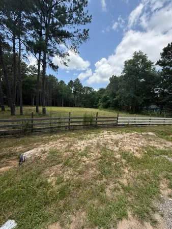 a view of outdoor space with deck and trees