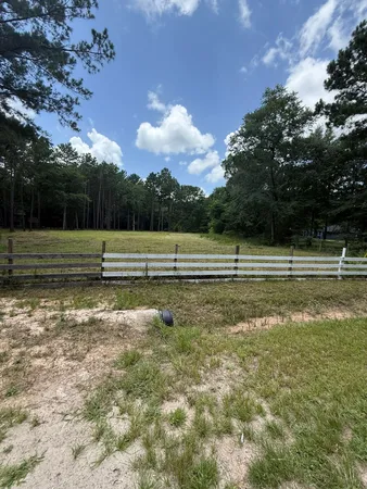 a view of a golf course with a lake
