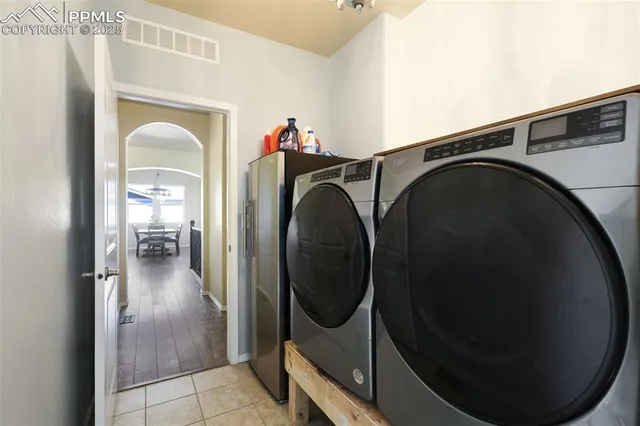 a view of a hallway with washer and dryer