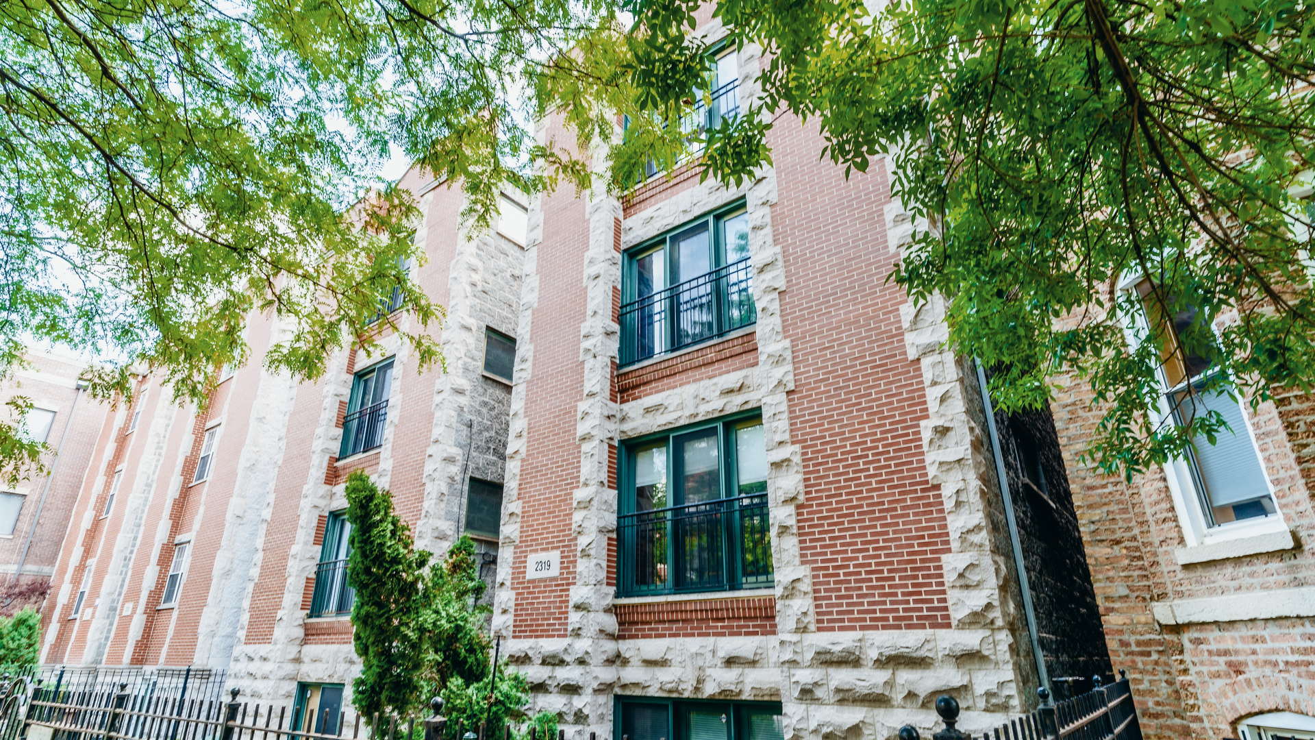 2319 West Harrison Street, Unit 4 Chicago, IL 60612 - Photo 2 of 25 a view of a house with a tree beside it