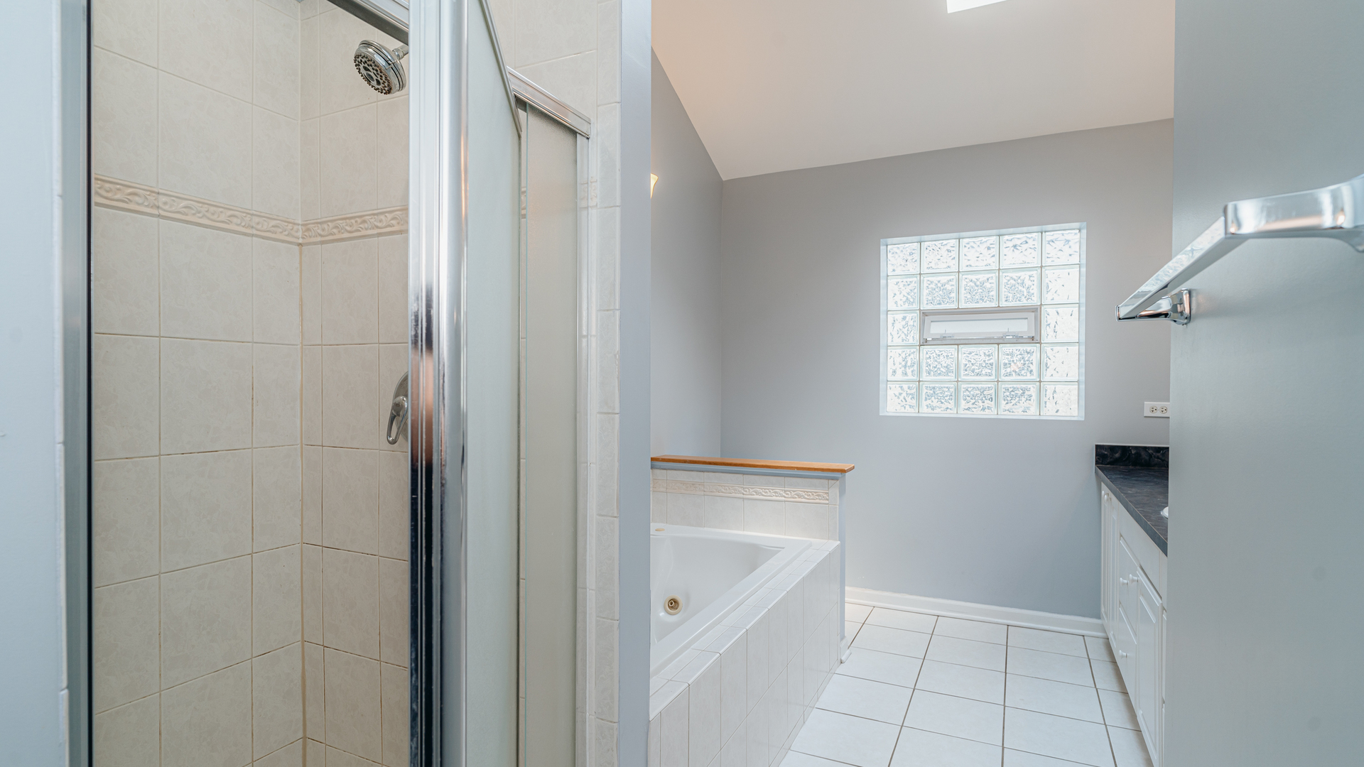2319 West Harrison Street, Unit 4 Chicago, IL 60612 - Photo 20 of 25 a bathroom with a bathtub and a shower