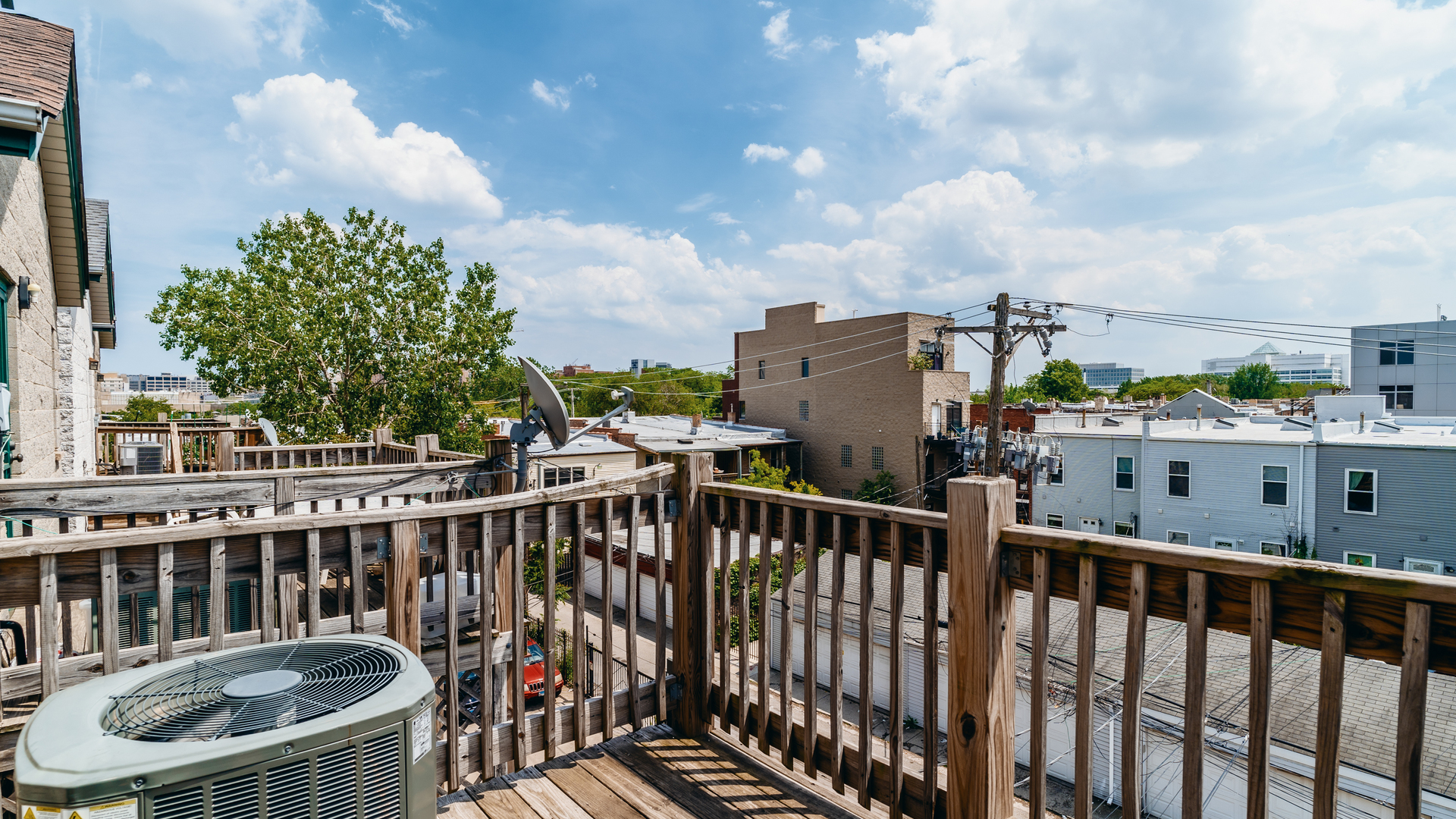2319 West Harrison Street, Unit 4 Chicago, IL 60612 - Photo 21 of 25 a view of a balcony with wooden floor and fence