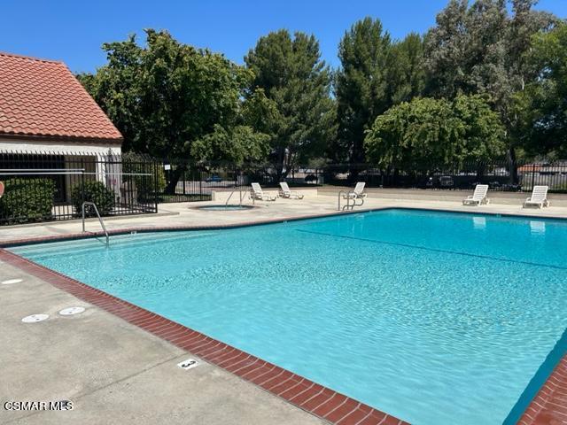 1724 Sinaloa Road, Unit 125 Simi Valley, CA 93065 - Photo 15 of 17 a view of pool with lawn chairs and plants