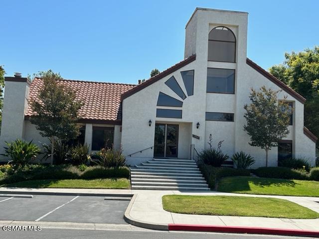 1724 Sinaloa Road, Unit 125 Simi Valley, CA 93065 - Photo 17 of 17 a front view of a house with a yard