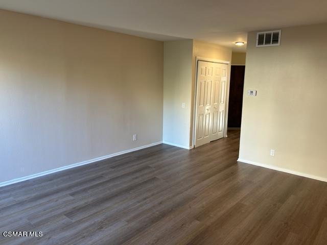 1724 Sinaloa Road, Unit 125 Simi Valley, CA 93065 - Photo 4 of 17 a view of an empty room with wooden floor